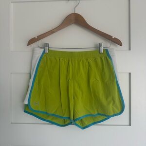 Under Armour Women’s Lime Green Athletic Shorts with blue trim. Size Large